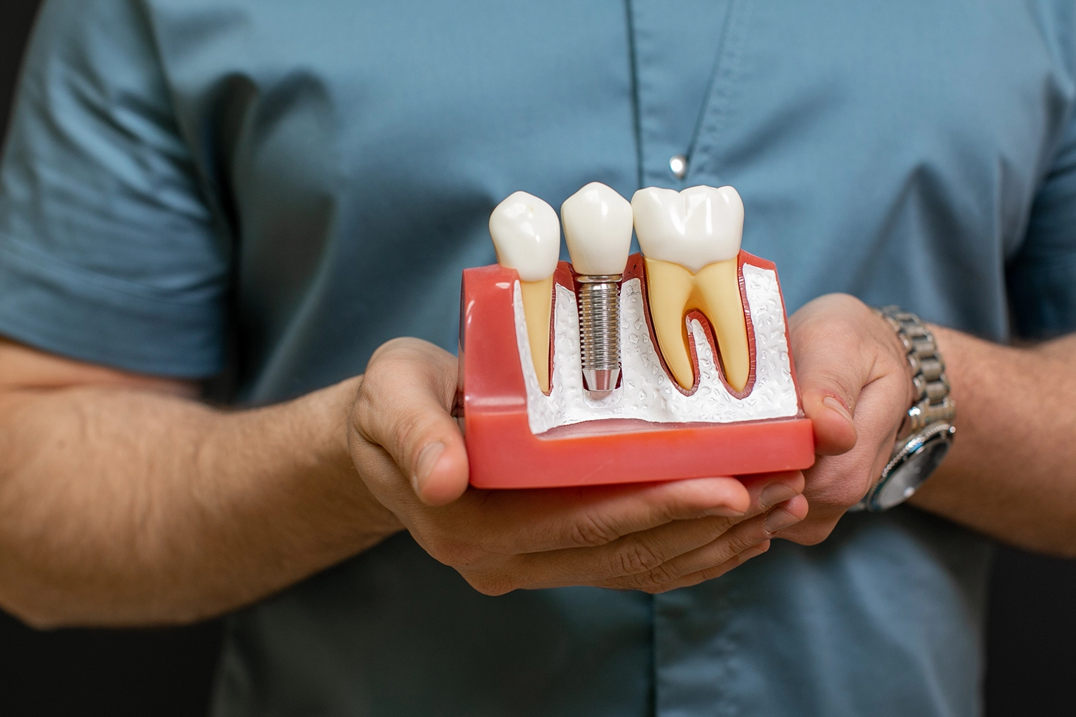 Dentist explaining dental implant treatment to a patient